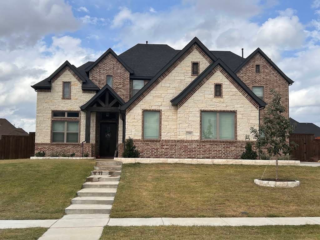 Michelle Arnold's home and front flowerbeds after a landscape improvement project